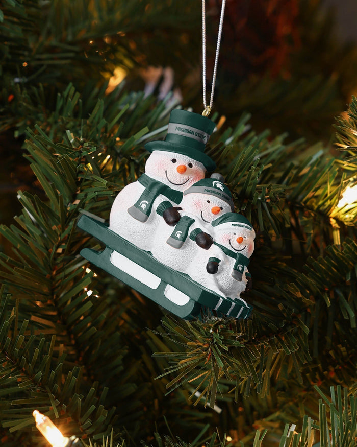 Michigan State Spartans Sledding Snowmen Ornament FOCO - FOCO.com