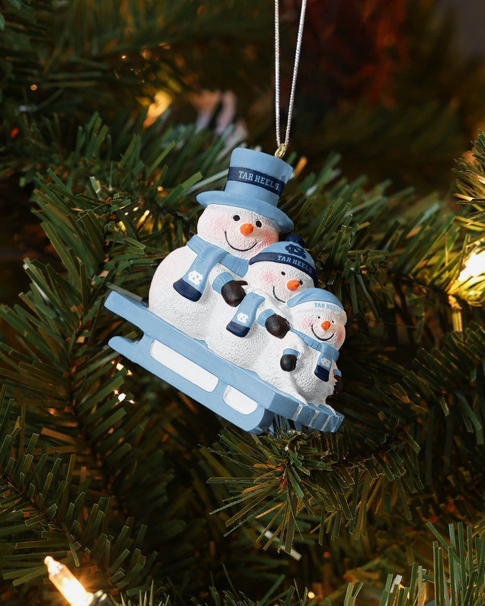 North Carolina Tar Heels Sledding Snowmen Ornament FOCO - FOCO.com